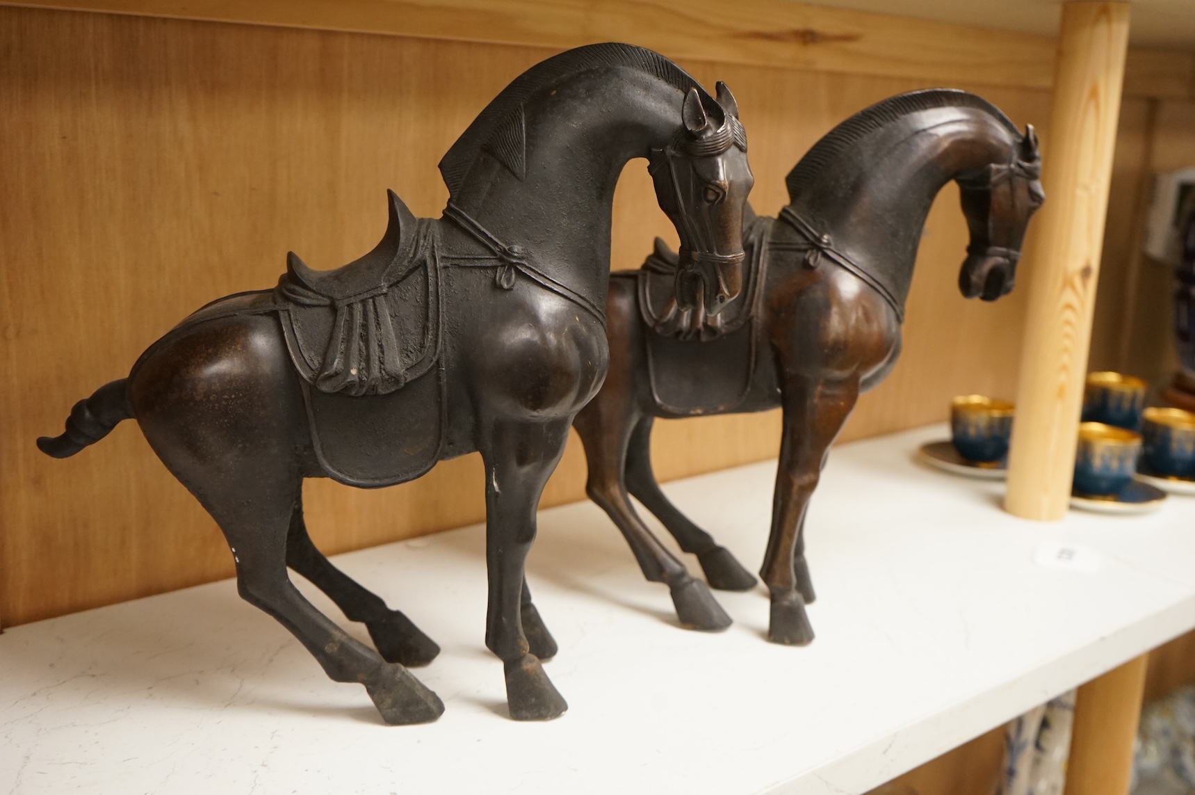 A pair of modern bronze figures of Tang horses, 30cm high